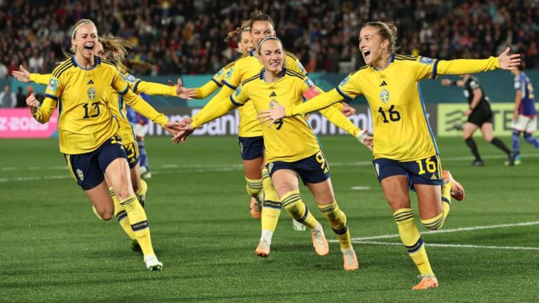 Sweden celebrate scoring a goal against Japan