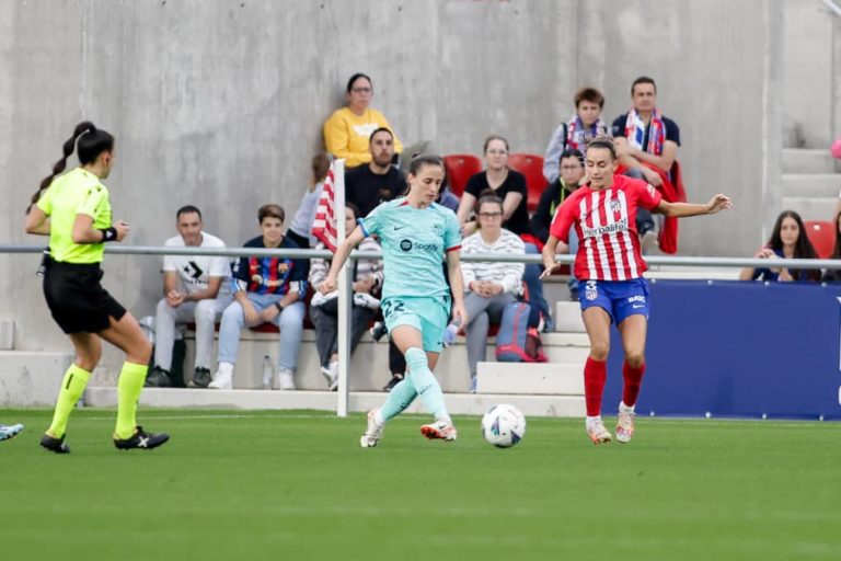 Barcelona Femeni in action against Atletico Madrid