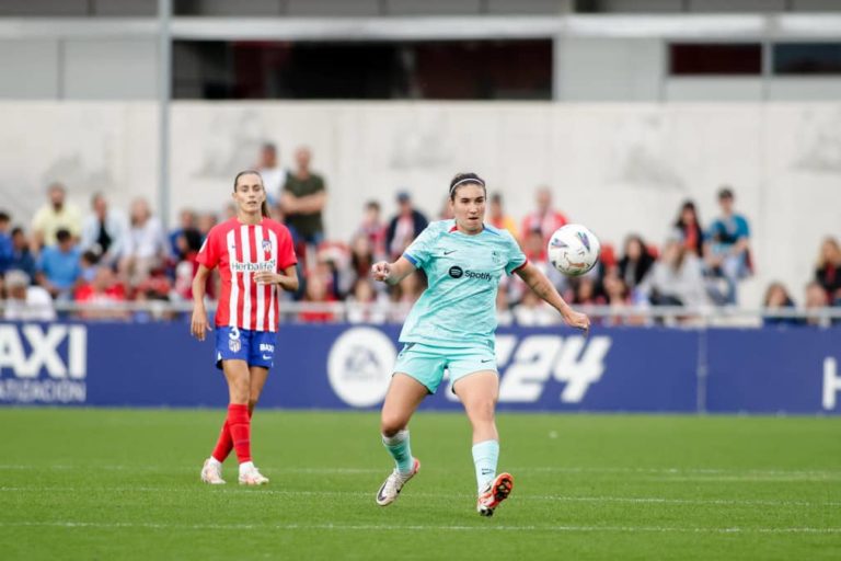 Barcelona Femeni in action against Atletico Madrid